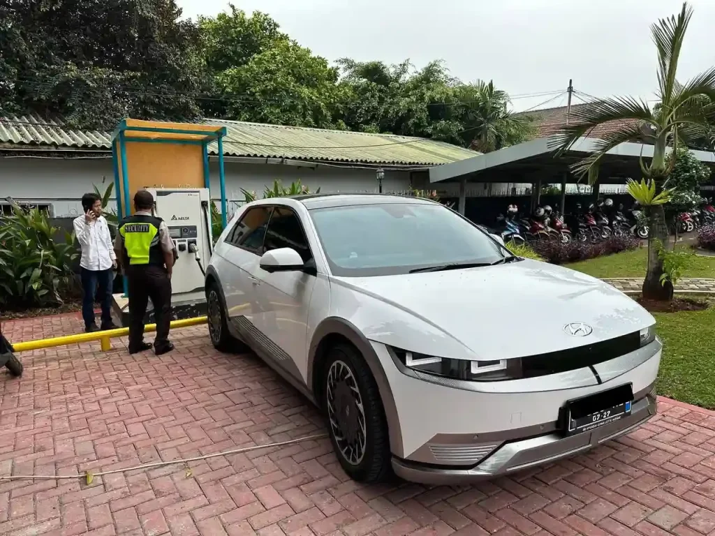 Hyundai Ioniq 5 electric car charging at a public charging station in Bali